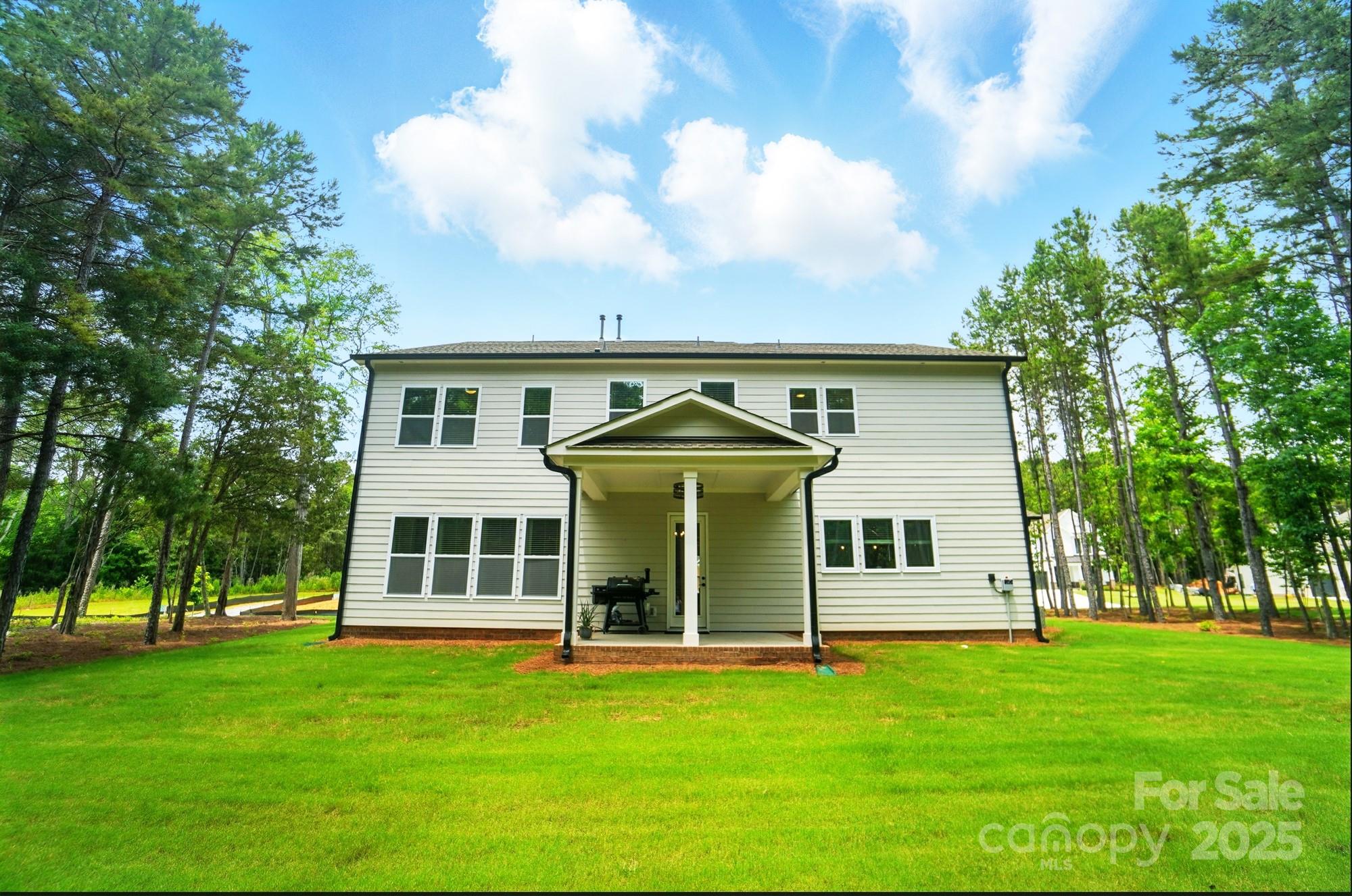7818 Russell Road Indian Trail, NC 28079 - Photo 37 of 42 a front view of a house with a garden