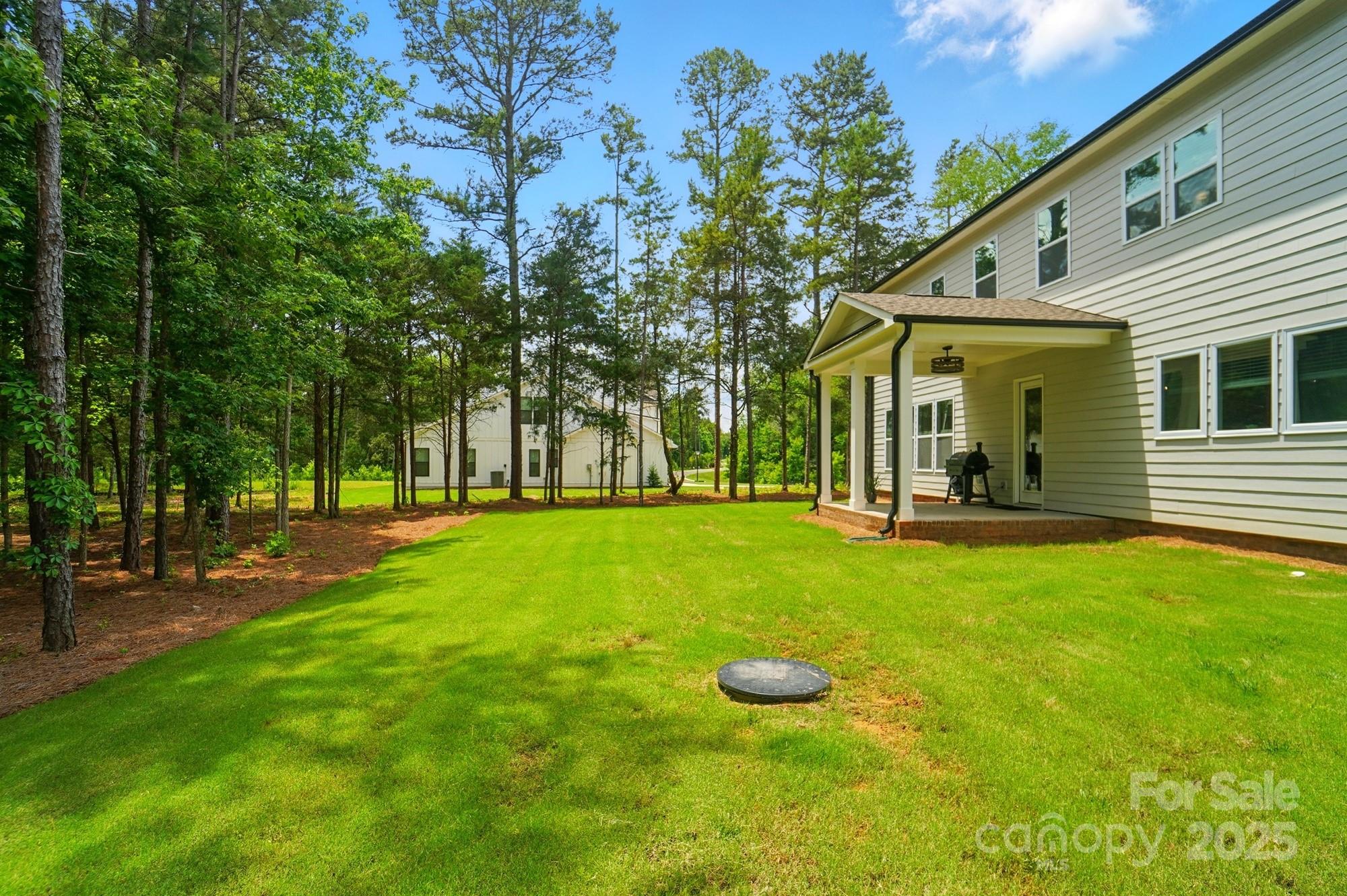 7818 Russell Road Indian Trail, NC 28079 - Photo 41 of 42 a view of a house with a backyard