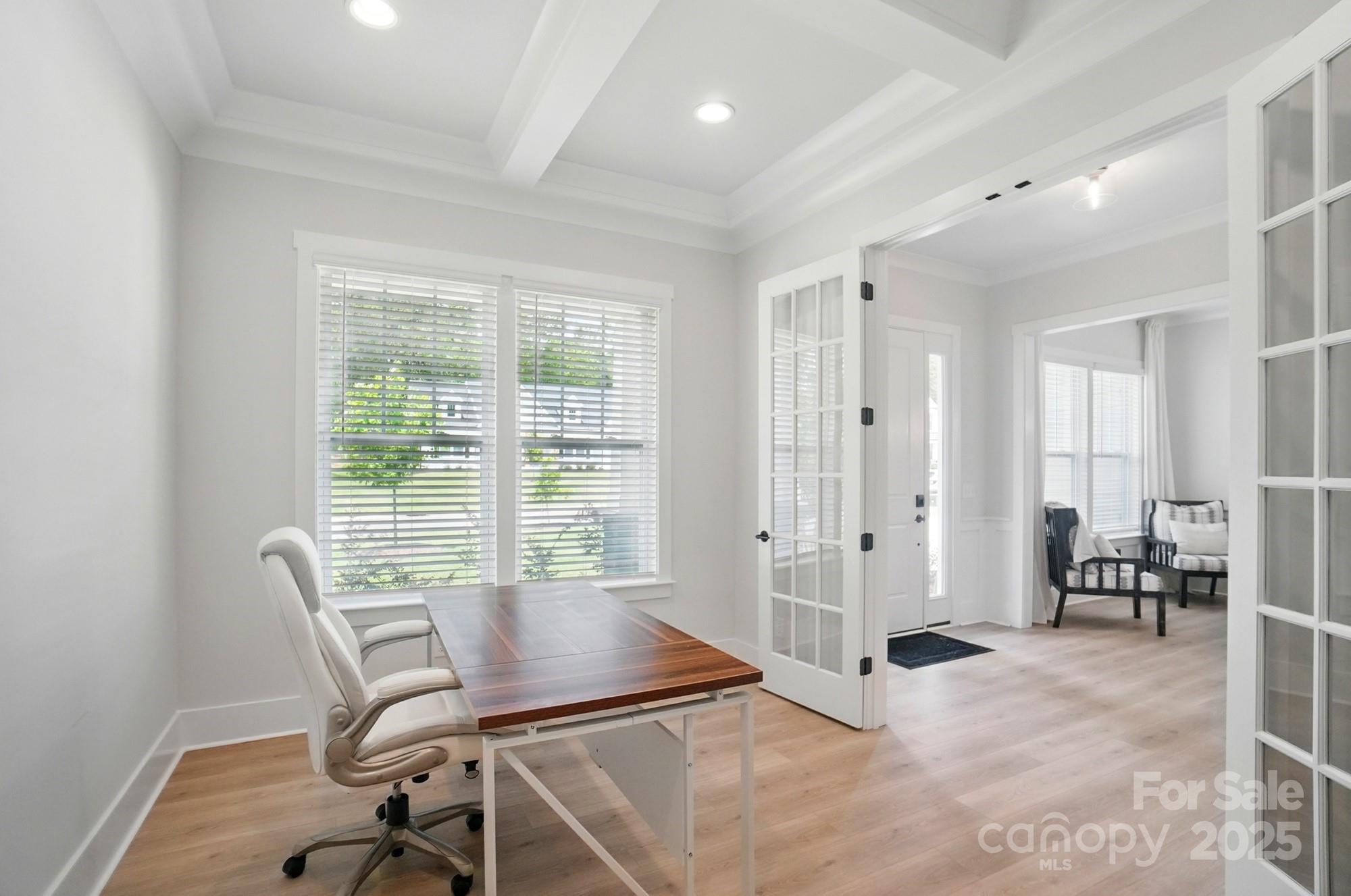 7818 Russell Road Indian Trail, NC 28079 - Photo 6 of 42 a view of a workspace with furniture and a window