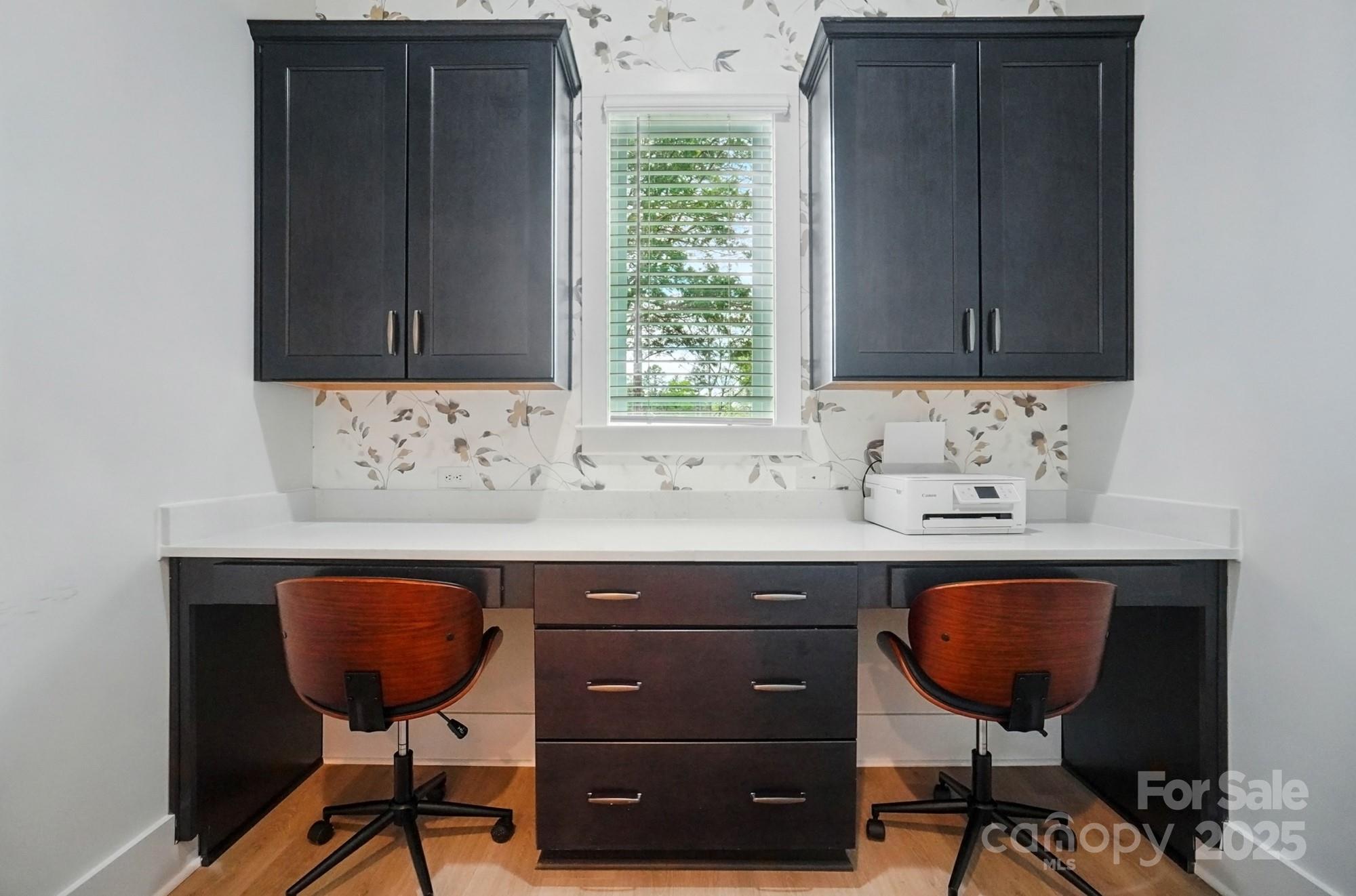 7818 Russell Road Indian Trail, NC 28079 - Photo 7 of 42 a view of cabinets a sink and a window in it