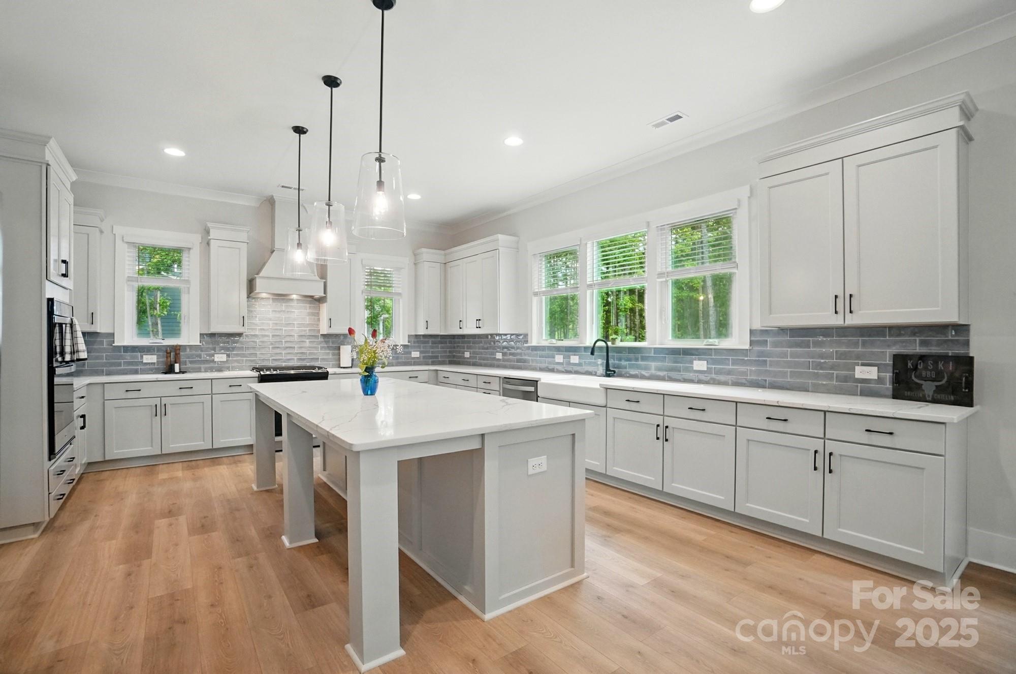 7818 Russell Road Indian Trail, NC 28079 - Photo 10 of 42 a kitchen with counter top space a sink cabinets and appliances