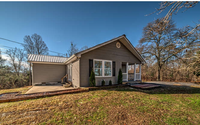 277 Damascus Road Blue Ridge, GA 30513 - Photo 1 of 1 a front view of a house with garden