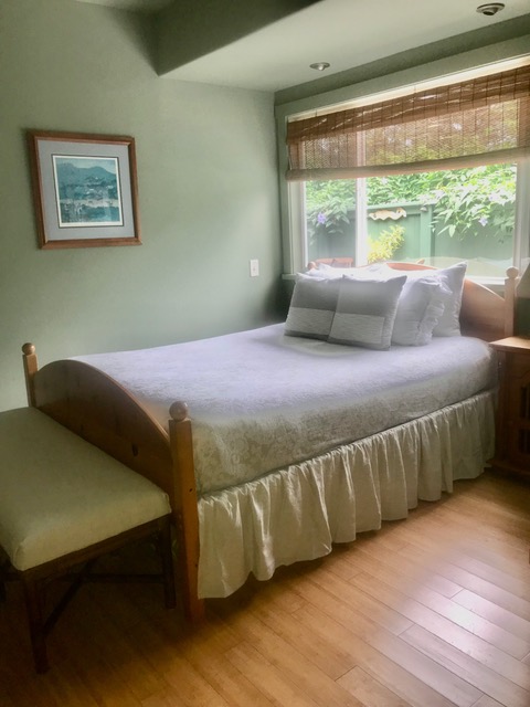 6562 Kahuna Road Kapaa, HI 96746 - Photo 12 of 14 a bed sitting in a bedroom next to a window