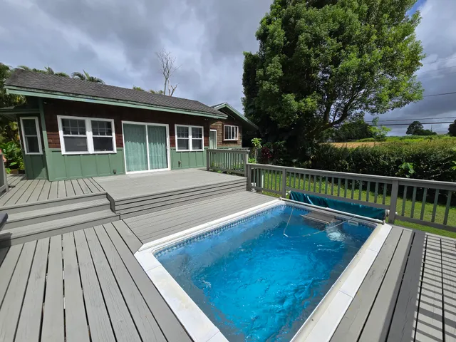 a view of house with a deck