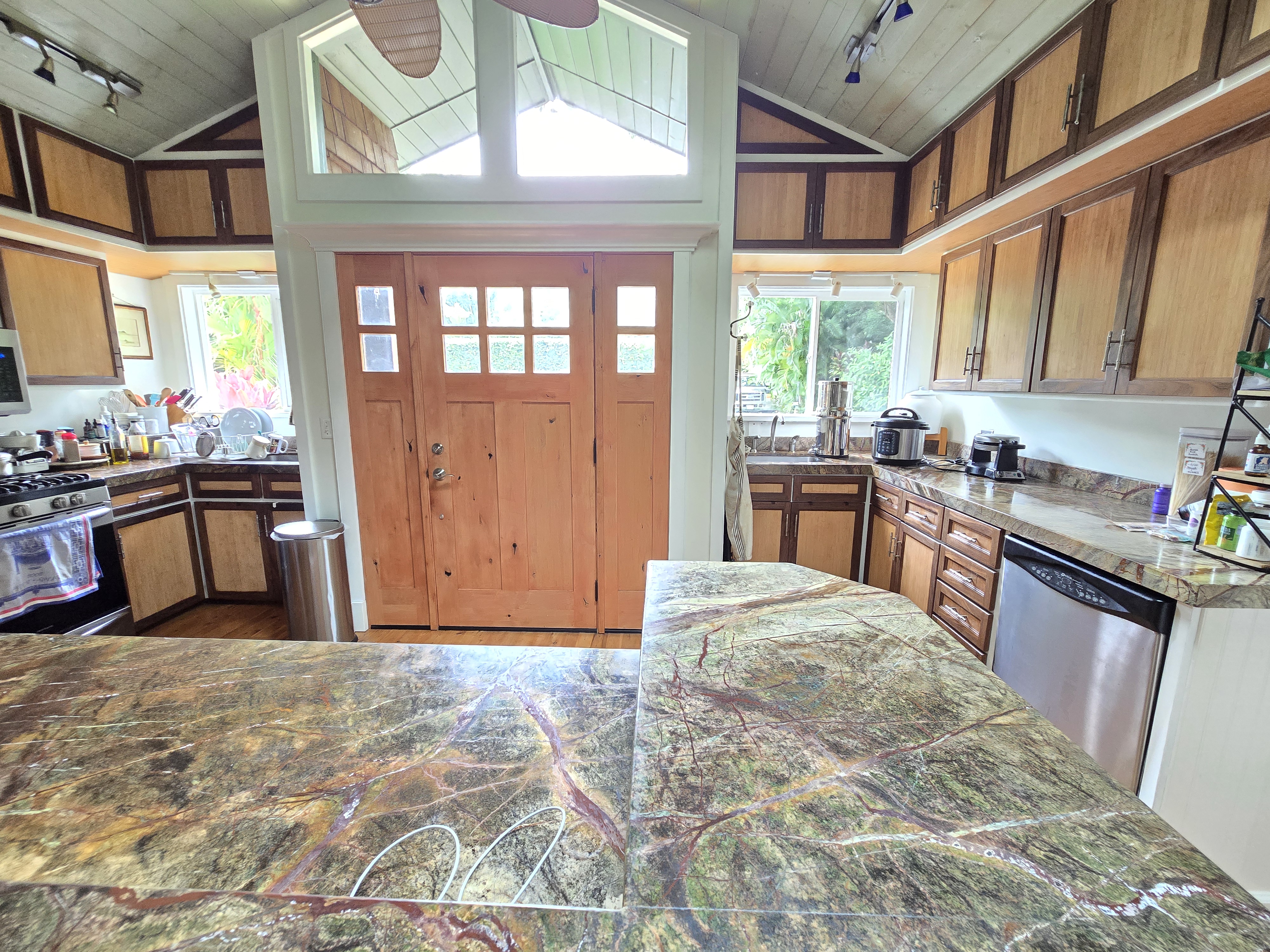 6562 Kahuna Road Kapaa, HI 96746 - Photo 5 of 14 a kitchen with stainless steel appliances granite countertop a stove a sink and a refrigerator
