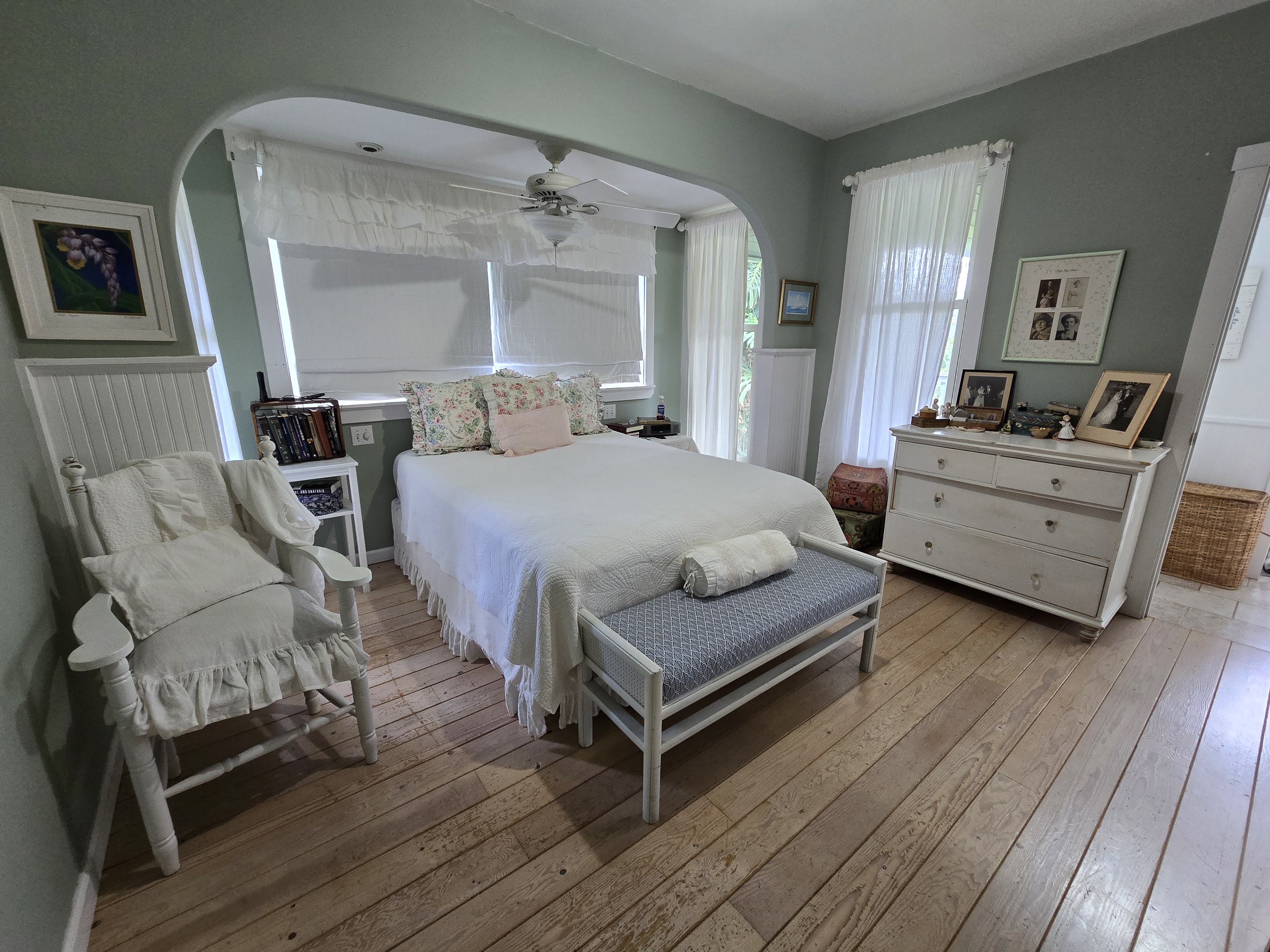 6562 Kahuna Road Kapaa, HI 96746 - Photo 7 of 14 a bedroom with a bed and wooden floor