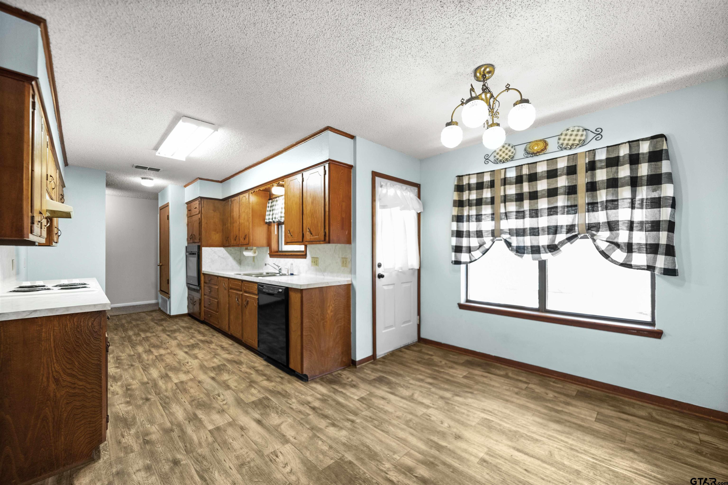 13518 Larry Lane Tyler, TX 75709 - Photo 11 of 28 a view of a kitchen with a sink and cabinet