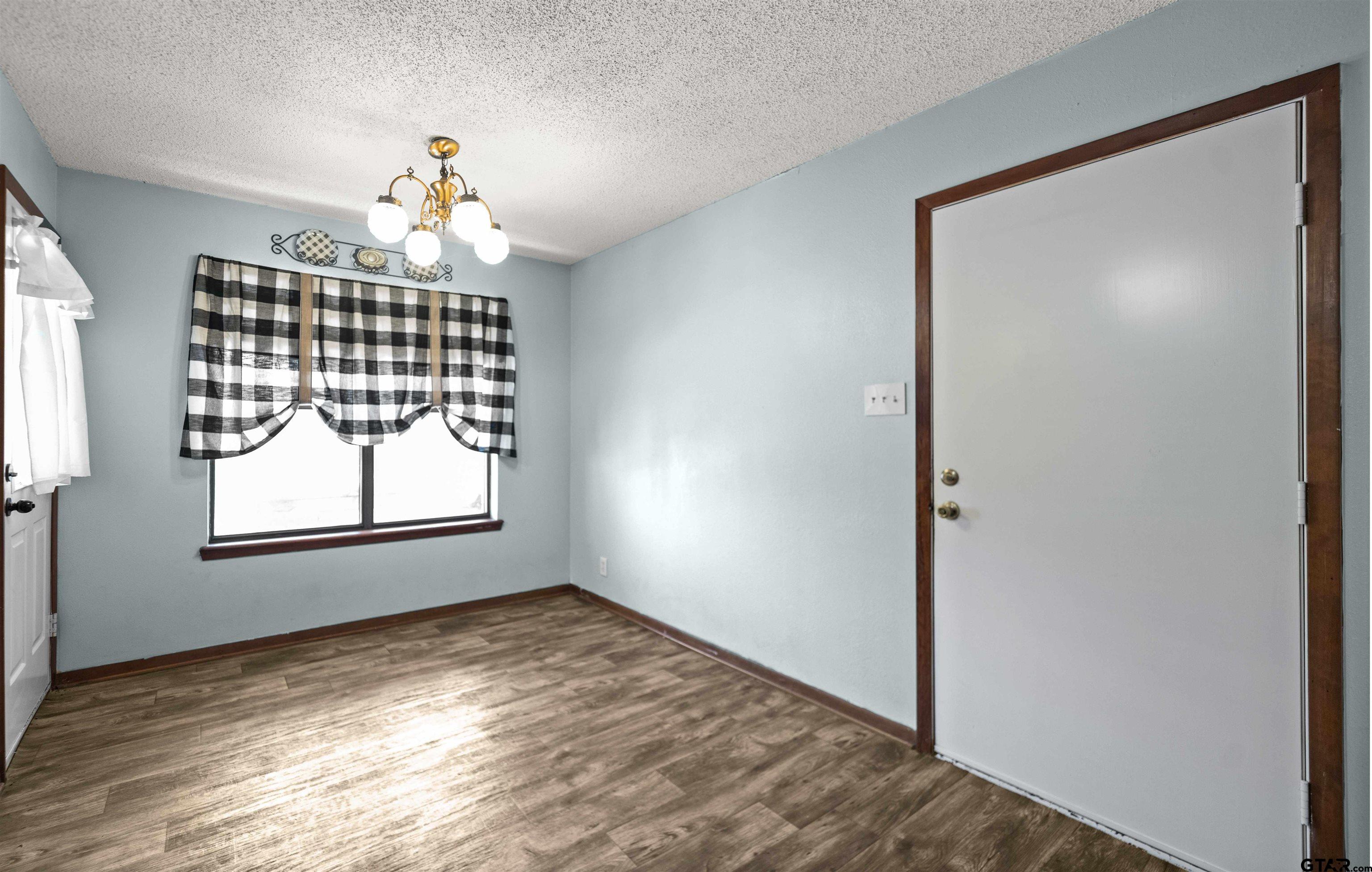 13518 Larry Lane Tyler, TX 75709 - Photo 12 of 28 an empty room with windows