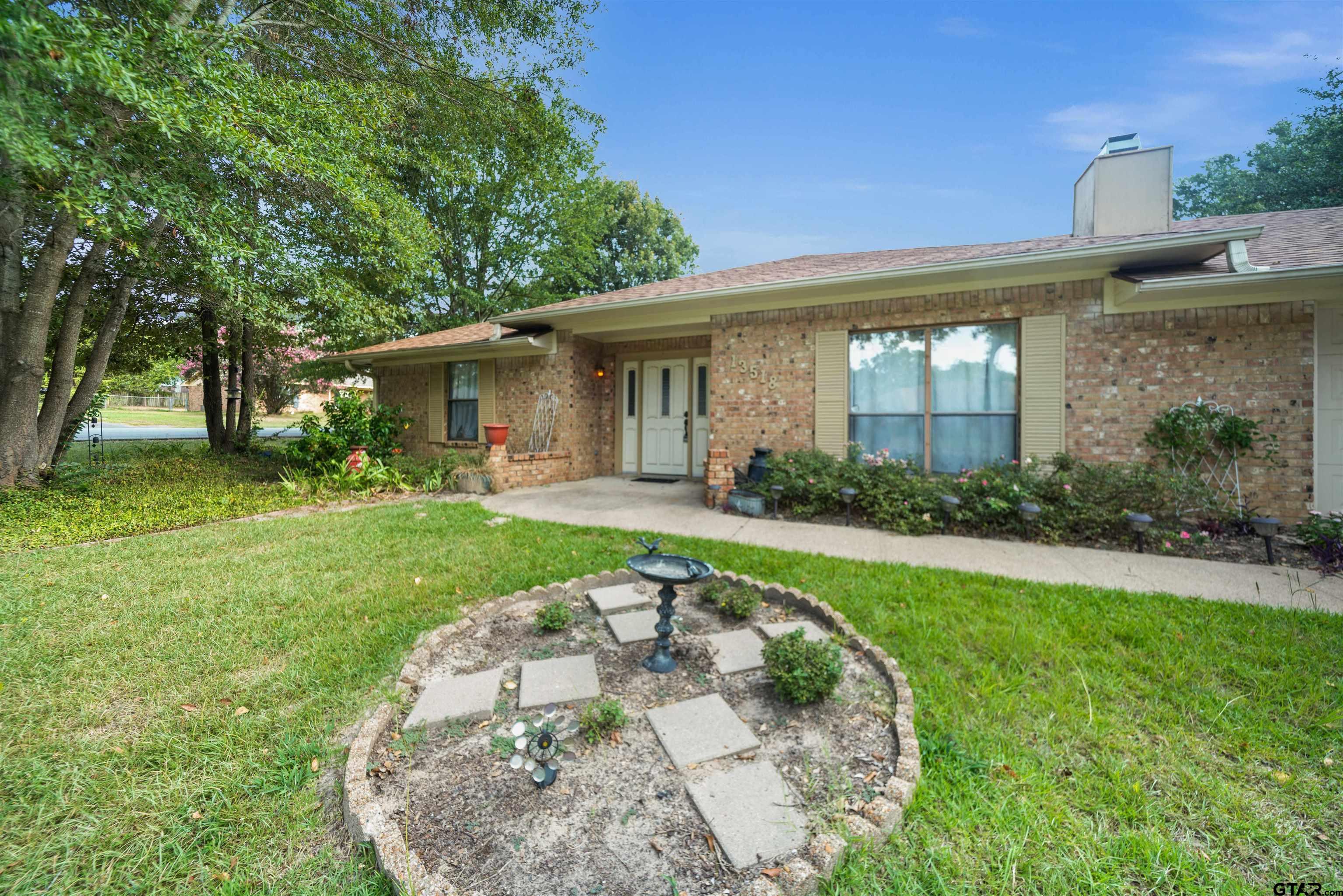 13518 Larry Lane Tyler, TX 75709 - Photo 2 of 28 front view of a house with a yard