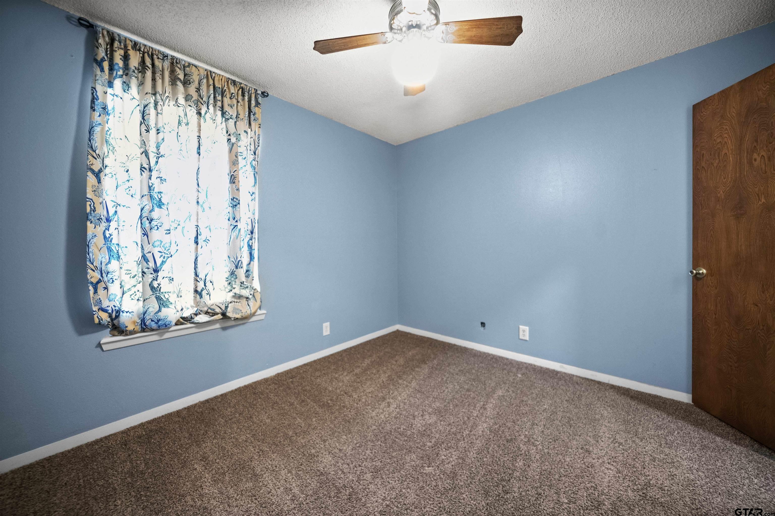 13518 Larry Lane Tyler, TX 75709 - Photo 21 of 28 an empty room with a window