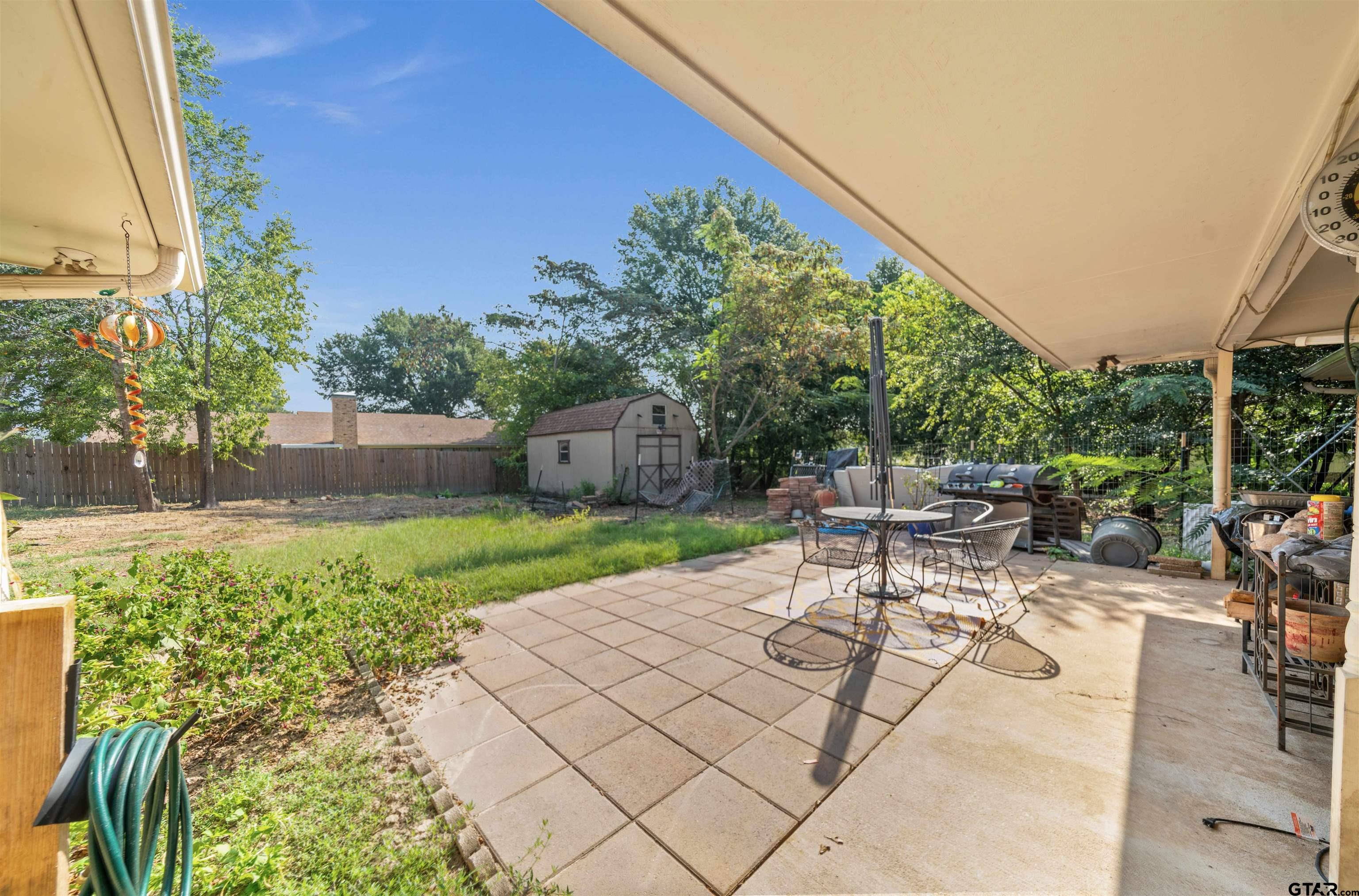 13518 Larry Lane Tyler, TX 75709 - Photo 24 of 28 a view of a backyard with sitting area
