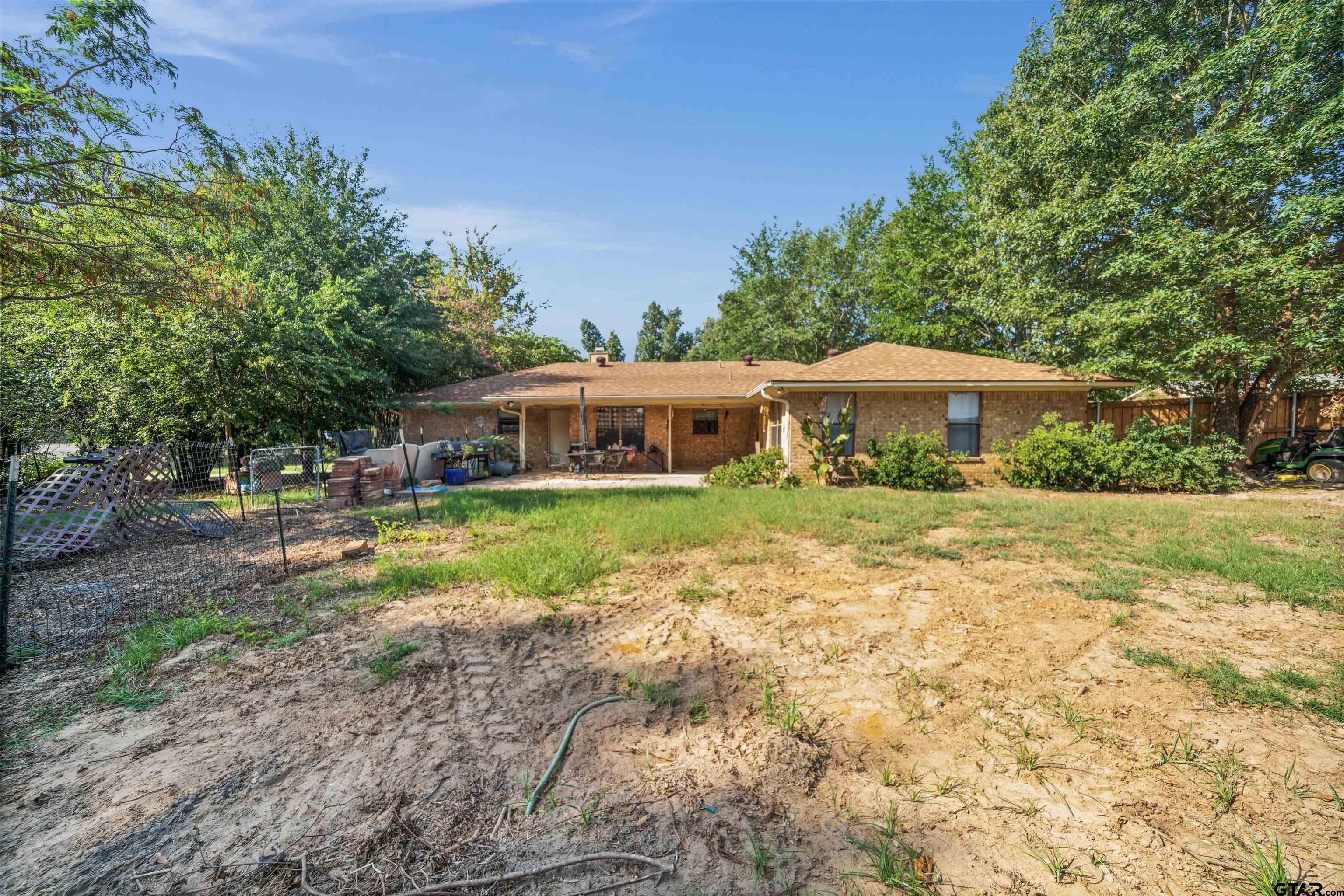 13518 Larry Lane Tyler, TX 75709 - Photo 26 of 28 a front view of a house with yard and green space