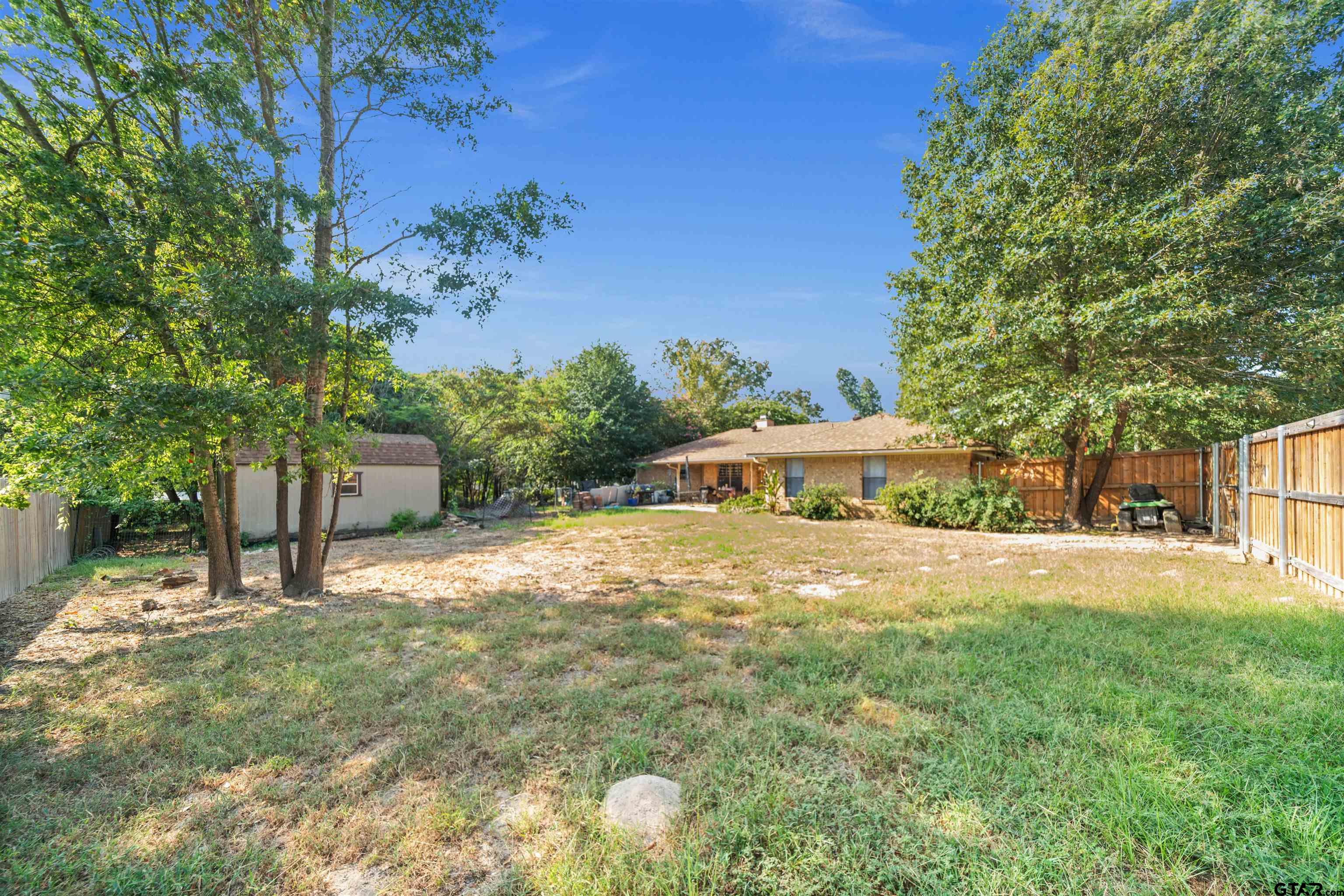13518 Larry Lane Tyler, TX 75709 - Photo 27 of 28 a front view of a house with a yard