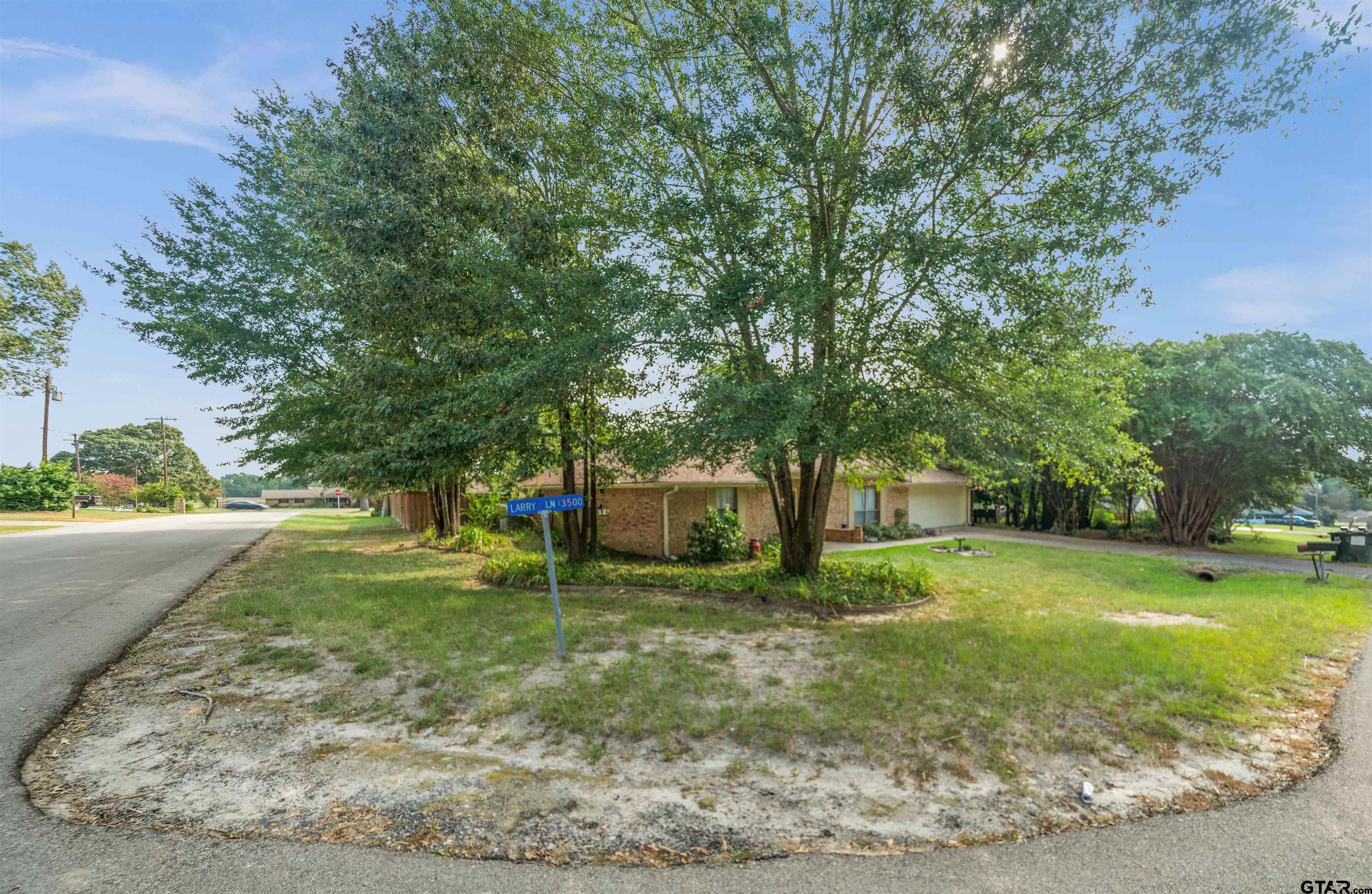 13518 Larry Lane Tyler, TX 75709 - Photo 28 of 28 a view of a house with a yard