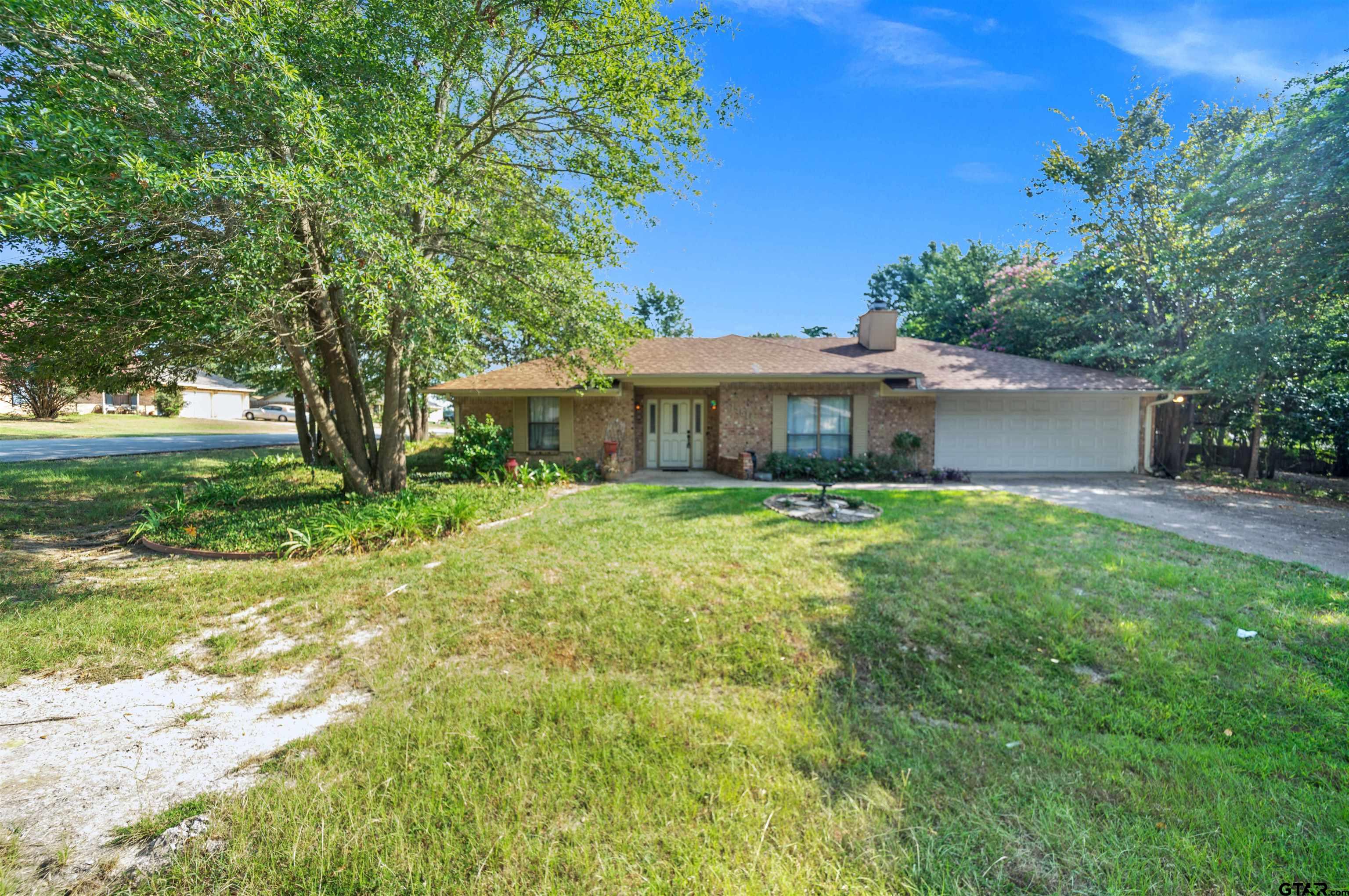 13518 Larry Lane Tyler, TX 75709 - Photo 3 of 28 a front view of a house with garden