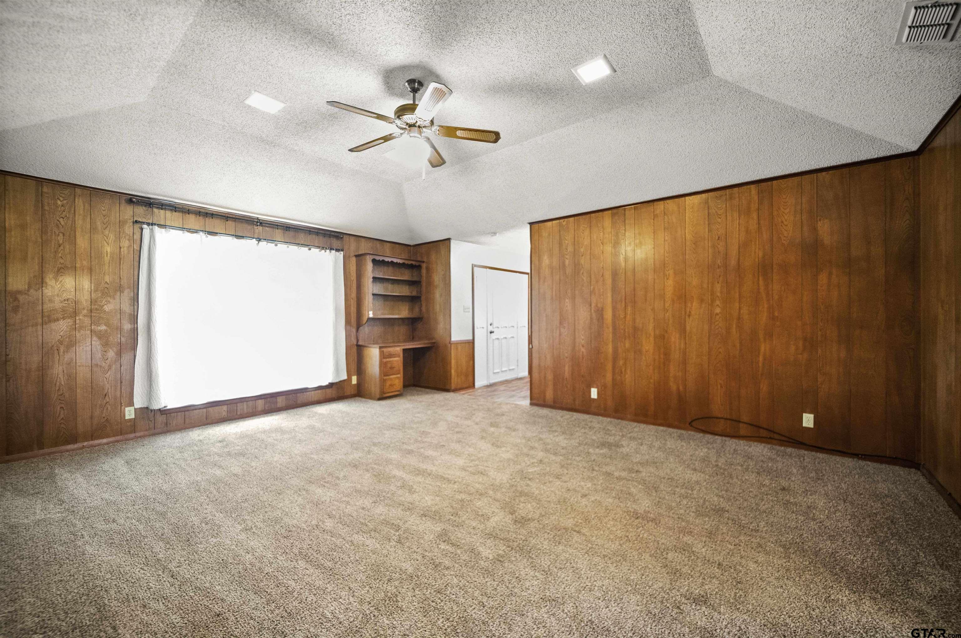 13518 Larry Lane Tyler, TX 75709 - Photo 8 of 28 an empty room with windows and closet