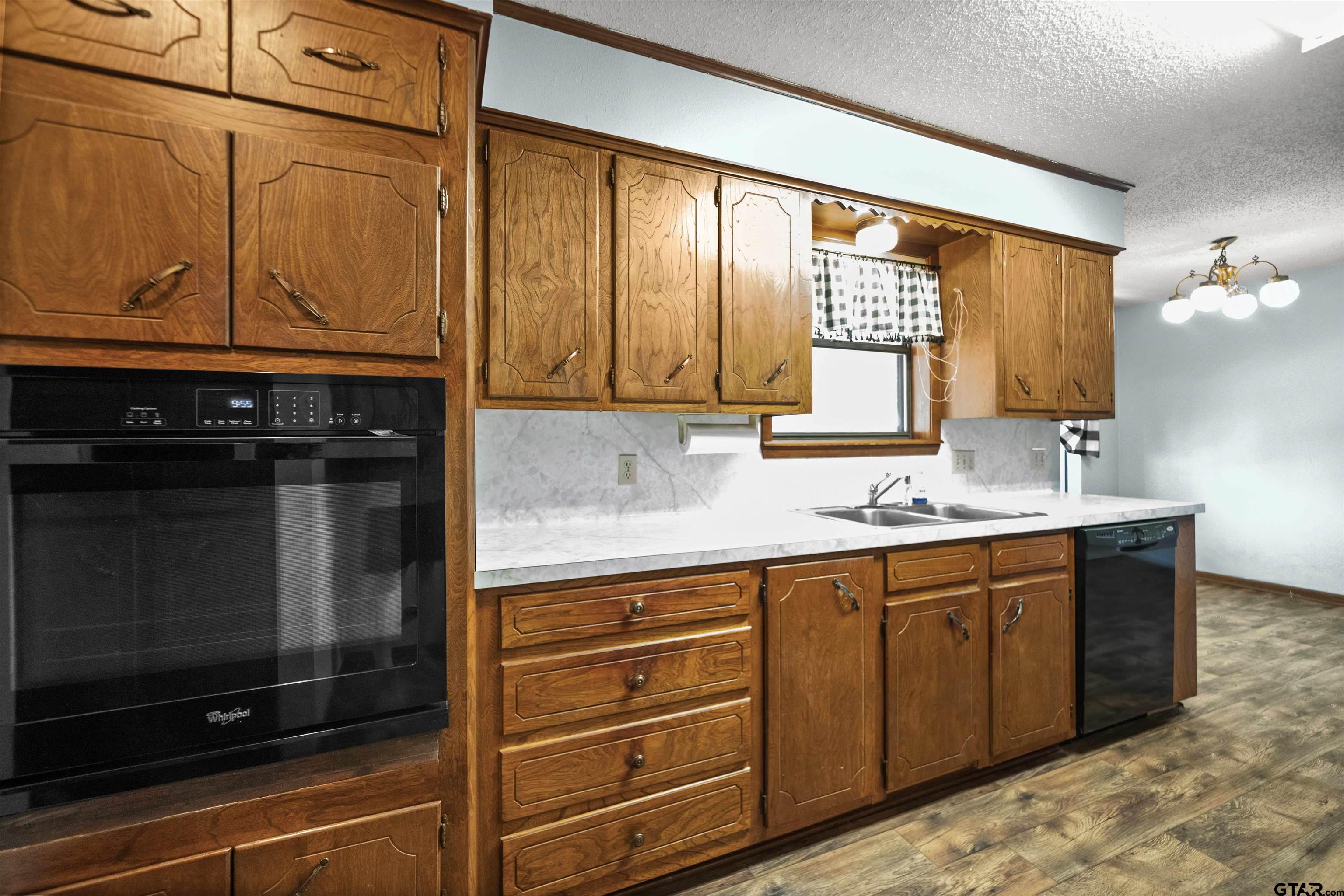 13518 Larry Lane Tyler, TX 75709 - Photo 9 of 28 a bathroom with a sink a mirror and a shower