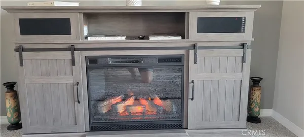 a living room with a fireplace