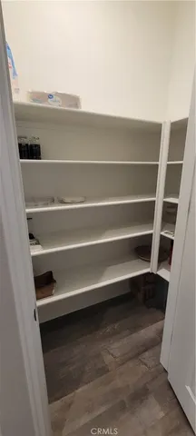 a bedroom with a bed and a television