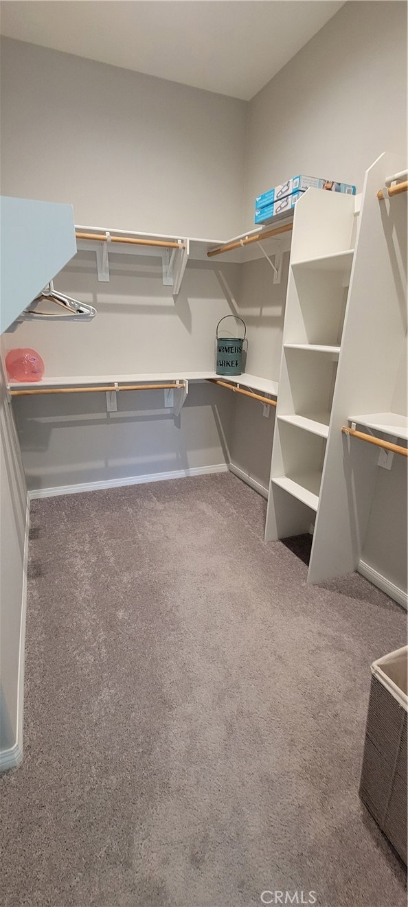 82 Burgundy Rancho Mirage, CA 92270 - Photo 19 of 42 a view of an empty room with racks on the wall