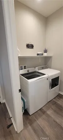 a utility room with washer and dryer