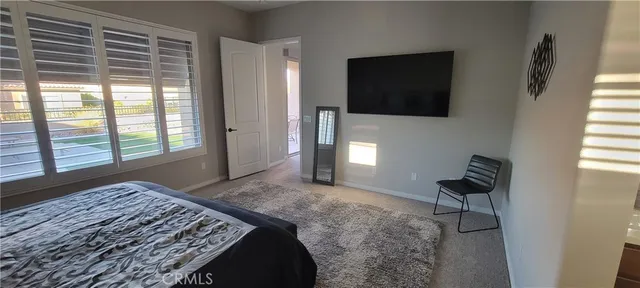 a bathroom with a toilet a sink and a mirror