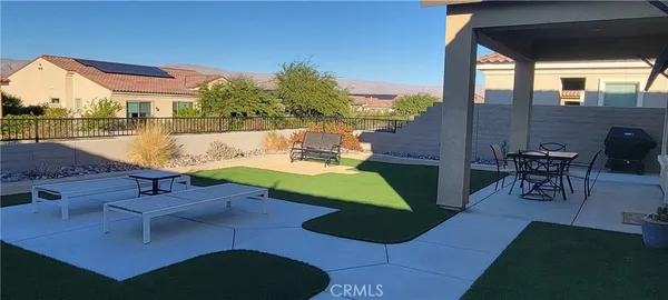 a view of a swimming pool with a patio