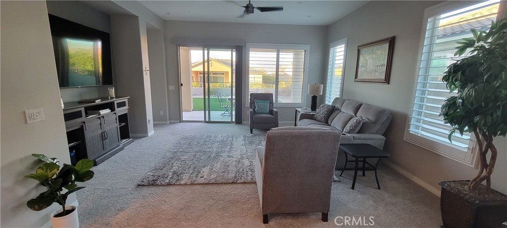 82 Burgundy Rancho Mirage, CA 92270 - Photo 10 of 42 a living room with furniture potted plant and a flat screen tv