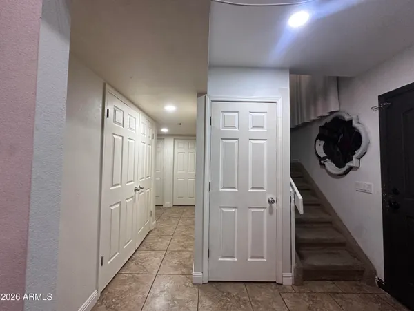 a view of a hallway with the washer and dryer