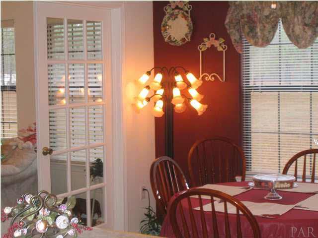 1475 Tedder Road Century, FL 32535 - Photo 18 of 24 BREAKFAST AREA LOOKING INTO SUNROOM
