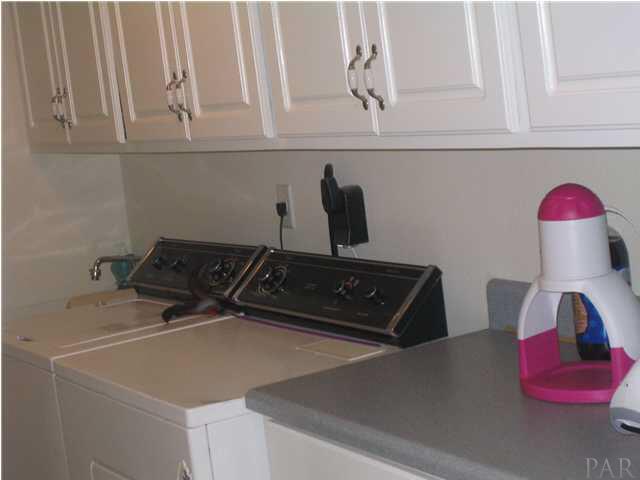 1475 Tedder Road Century, FL 32535 - Photo 23 of 24 LAUNDRY WITH AMPLE STORAGE & DEEP SINK