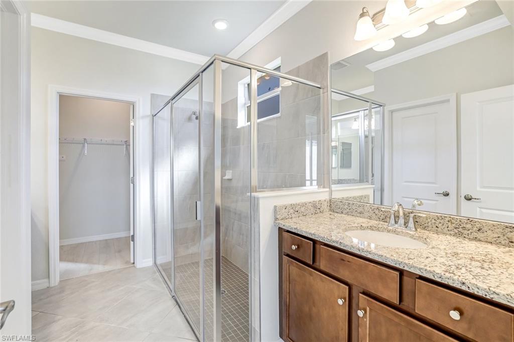 1750 Alameda Drive Naples, FL 34120 - Photo 11 of 39 a bathroom with a granite countertop sink mirror and double