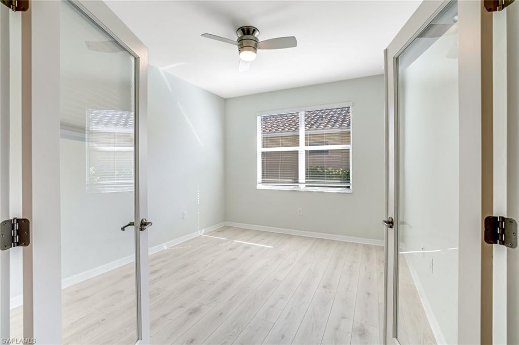 1750 Alameda Drive Naples, FL 34120 - Photo 13 of 39 a view of an empty room with a window