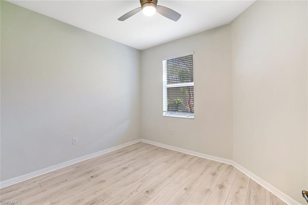 1750 Alameda Drive Naples, FL 34120 - Photo 15 of 39 an empty room with a window and a ceiling fan