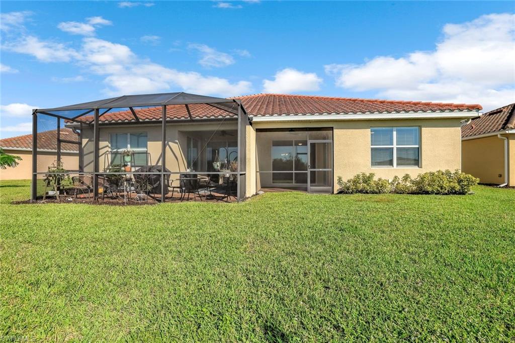 1750 Alameda Drive Naples, FL 34120 - Photo 18 of 39 a view of a house with backyard and porch