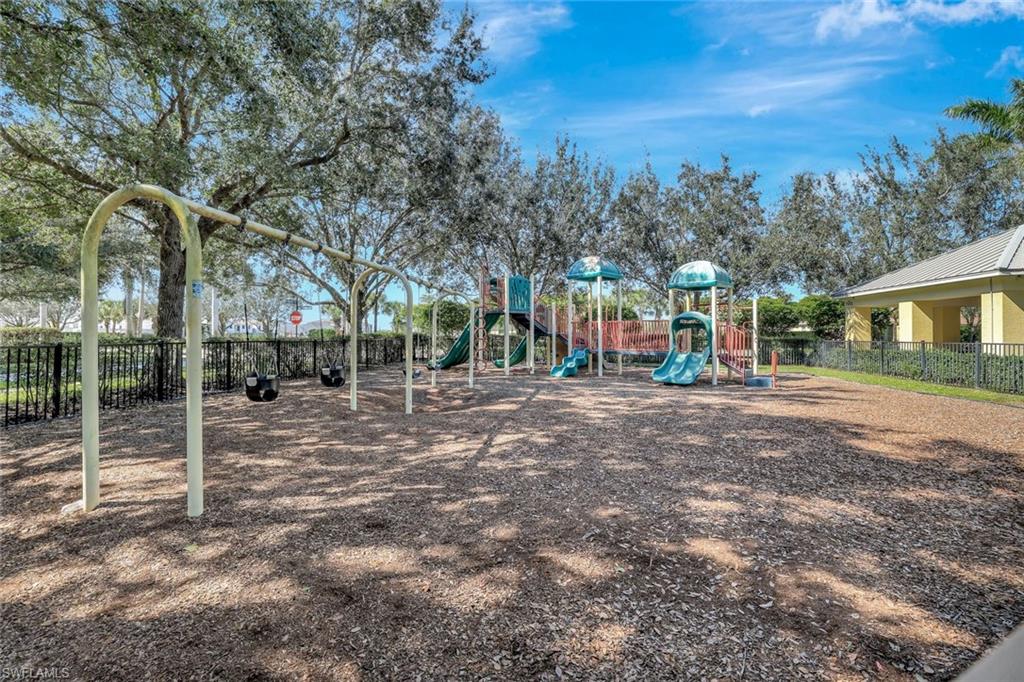 1750 Alameda Drive Naples, FL 34120 - Photo 32 of 39 a view of street with tall trees
