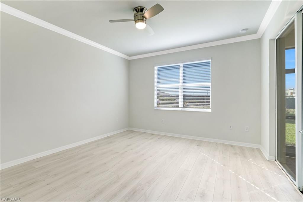 1750 Alameda Drive Naples, FL 34120 - Photo 9 of 39 an empty room with a window and ceiling fan
