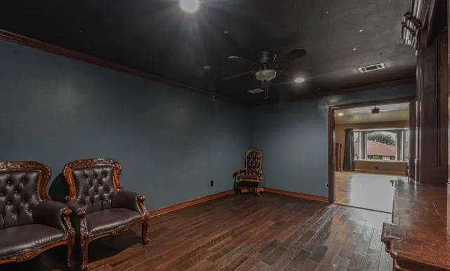 a view of an empty room with empty shelves