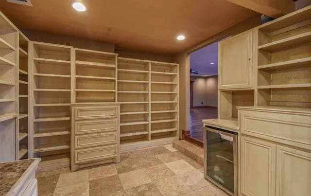 a bathroom with a granite countertop sink a toilet and bathtub