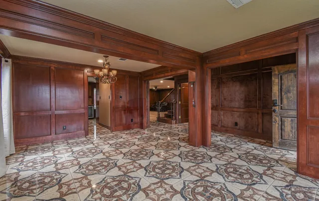 a view of a hallway with wooden walls