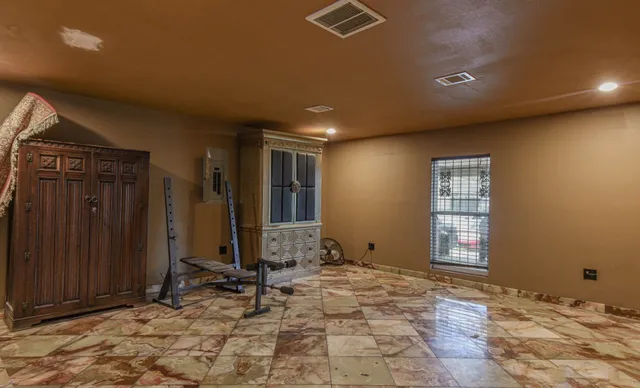 a view of a livingroom with a kitchen counter tops and wooden floor