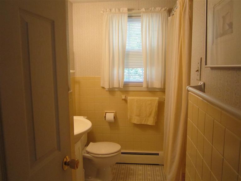 18 Birchill Road Centerville, MA 02632 - Photo 15 of 18 a bathroom with a granite countertop sink and a mirror