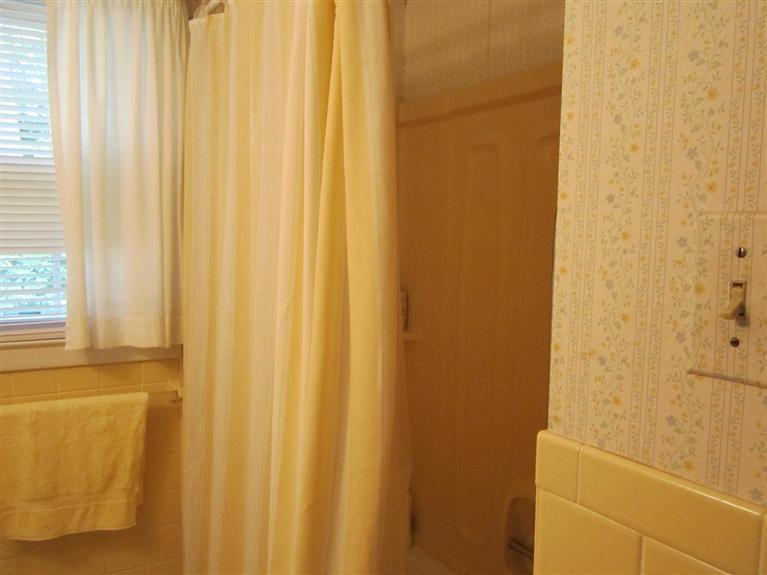 18 Birchill Road Centerville, MA 02632 - Photo 16 of 18 a bathroom with a shower curtain
