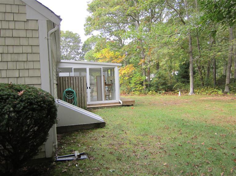 18 Birchill Road Centerville, MA 02632 - Photo 7 of 18 a view of a house with backyard and a tree