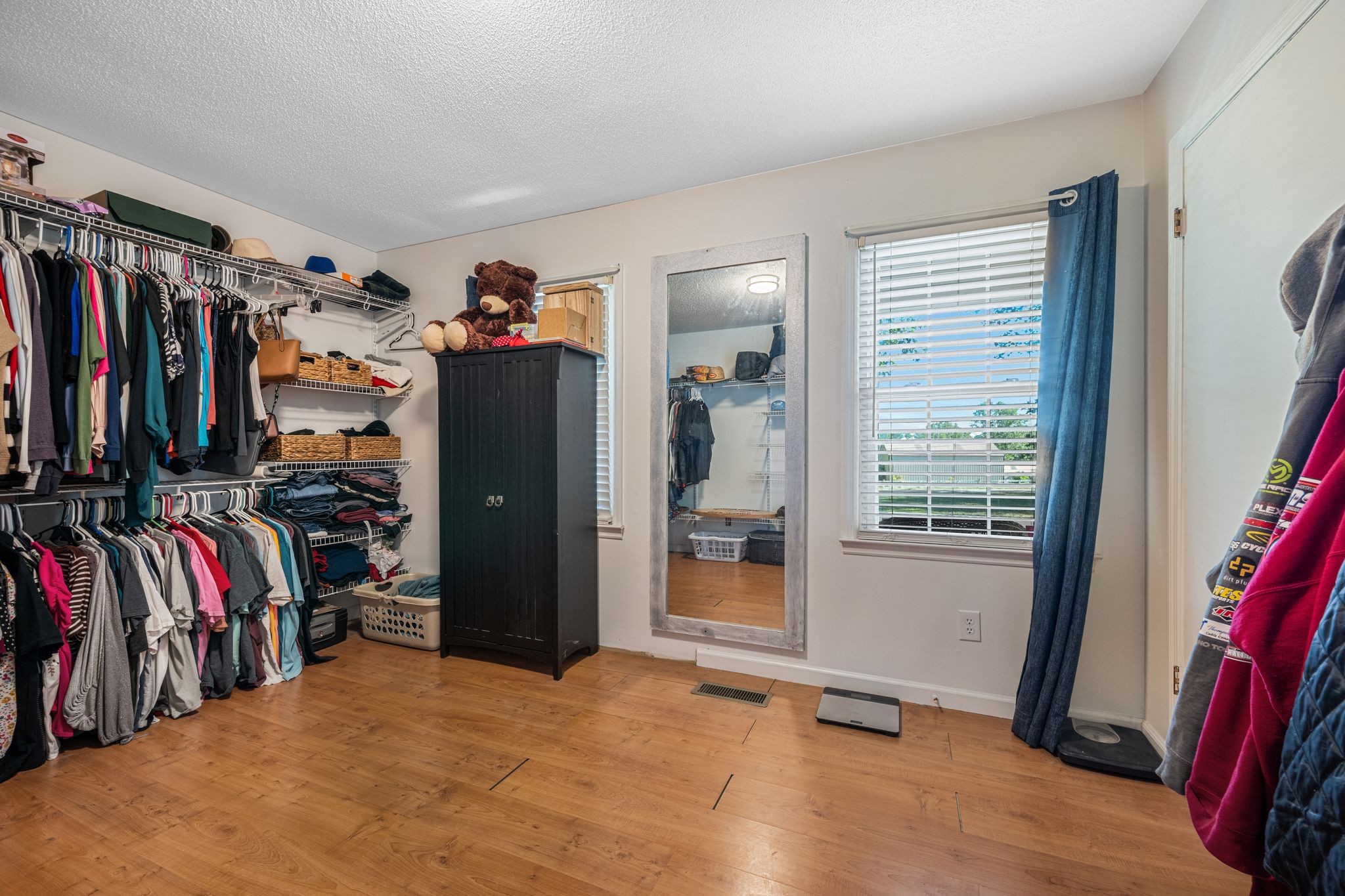 5835 Dog Creek Road Primm Springs, TN 38476 - Photo 14 of 37 a view of walk in closet with clothes and shoes