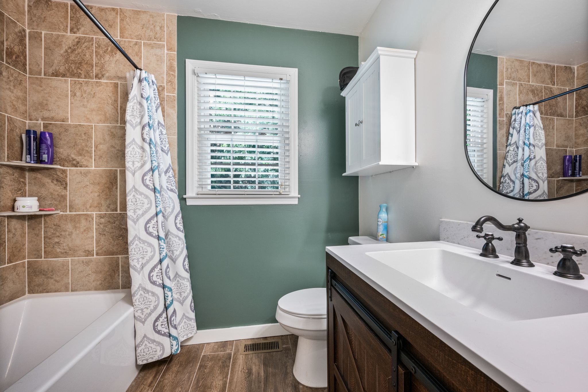 5835 Dog Creek Road Primm Springs, TN 38476 - Photo 16 of 37 a bathroom with a sink a toilet and a bathtub