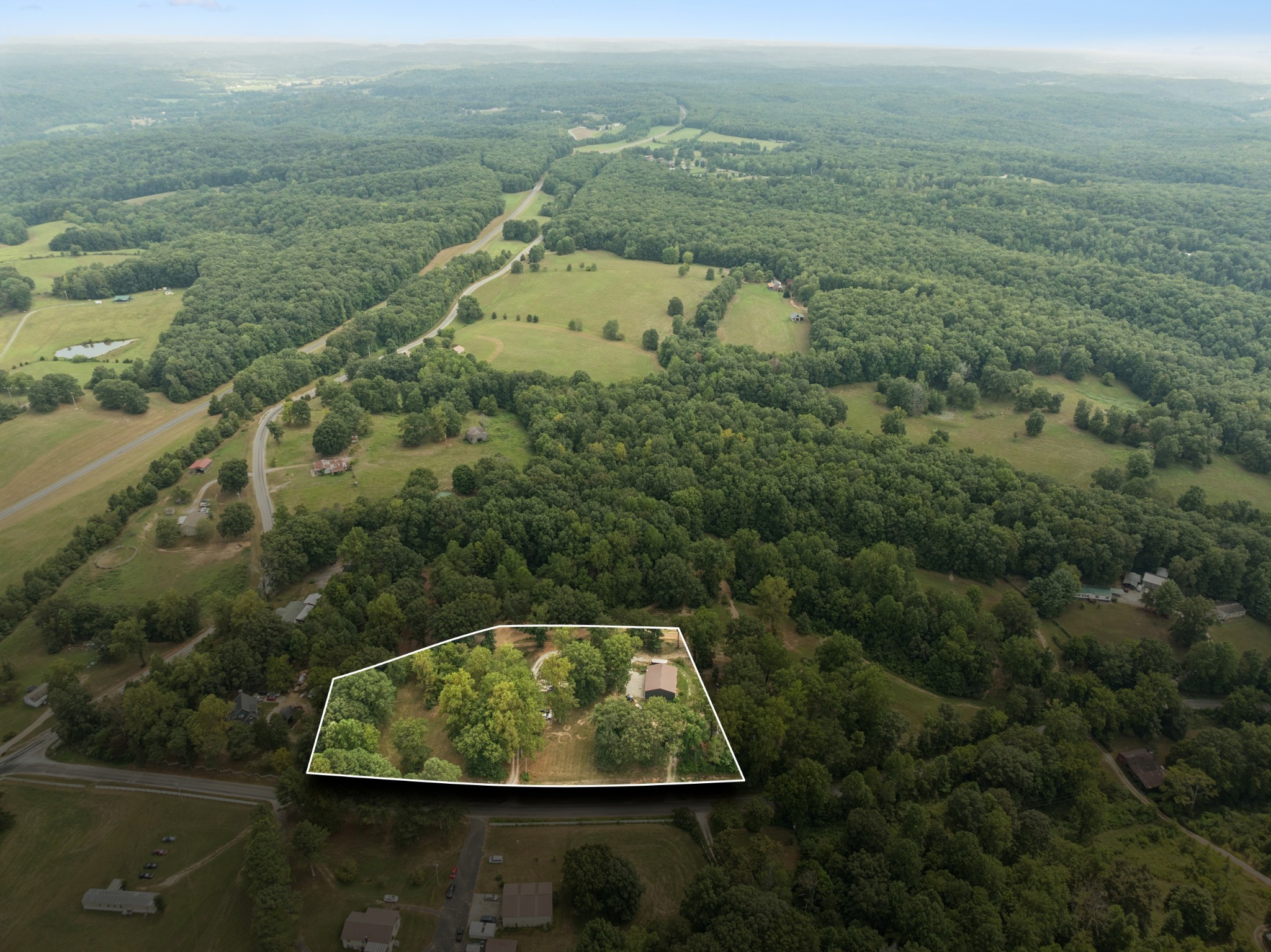 5835 Dog Creek Road Primm Springs, TN 38476 - Photo 23 of 37 an aerial view of residential houses with outdoor space and swimming pool