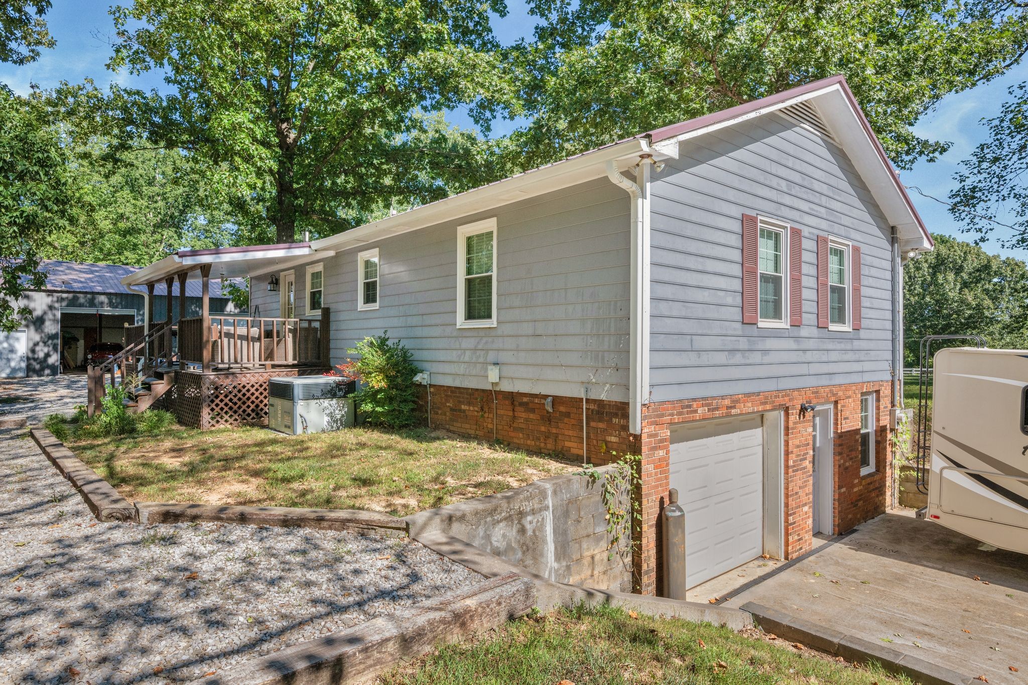 5835 Dog Creek Road Primm Springs, TN 38476 - Photo 35 of 37 a view of a house with backyard and sitting area