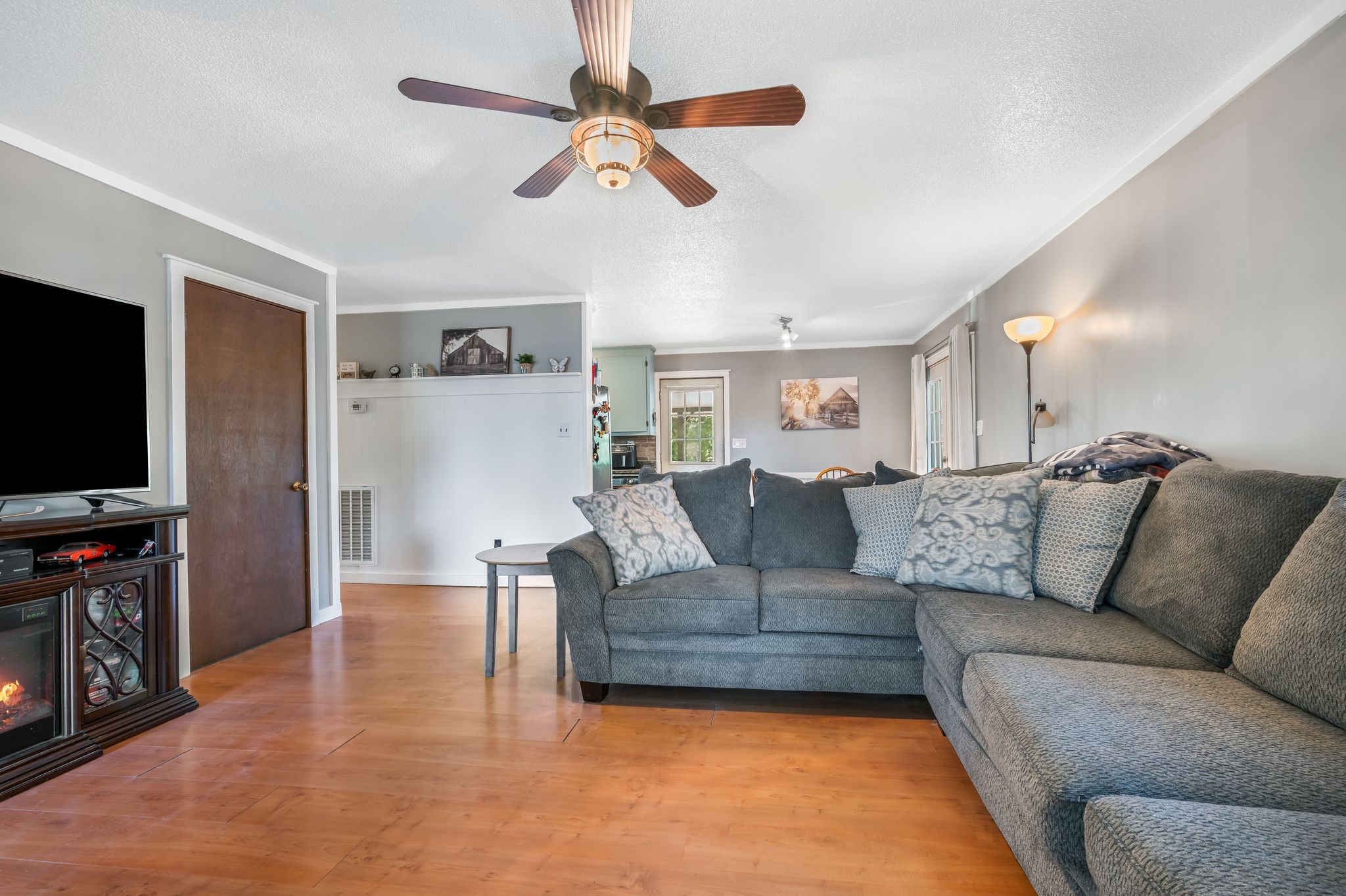 5835 Dog Creek Road Primm Springs, TN 38476 - Photo 4 of 37 a living room with furniture and a flat screen tv