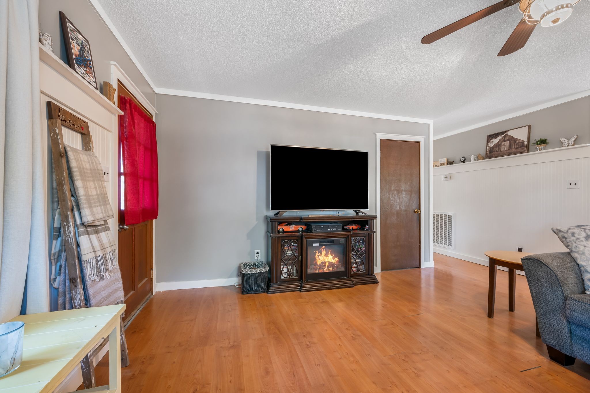 5835 Dog Creek Road Primm Springs, TN 38476 - Photo 10 of 37 a living room with furniture and a flat screen tv